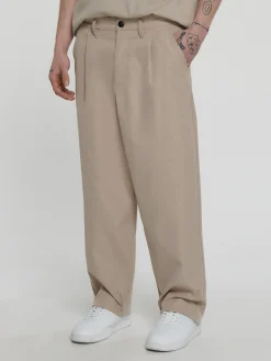 Beżowe spodnie loose ADU.LTD