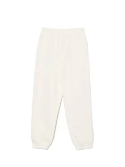 Kremowe dresowe joggery z naszywką