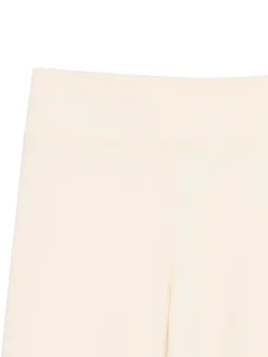 Kremowe dresy typu flare