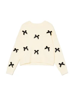 Kremowy sweter z kokardkami