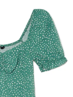 Zielona sukienka midi w stokrotki